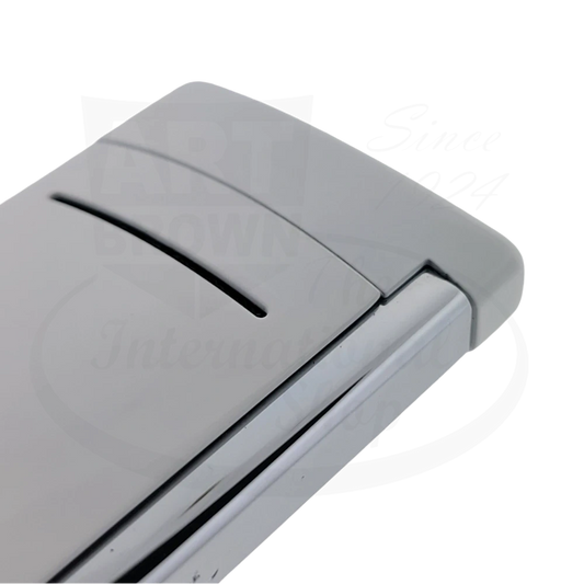 Corner of S.T. Dupont MiniJet Luxury Torch Lighter in white with chrome accents