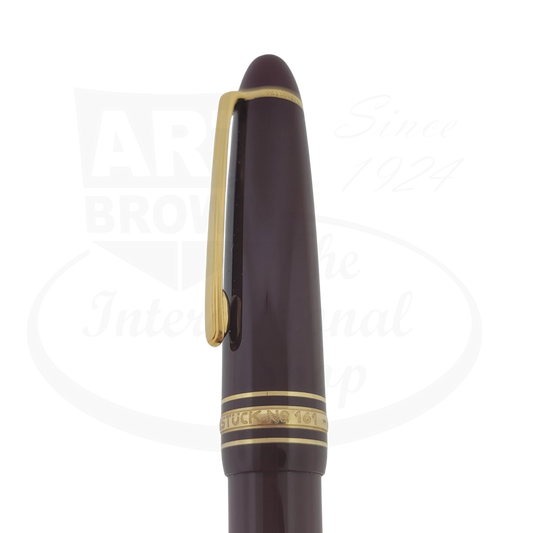 Montblanc Meisterstuck 161 Le Grand ballpoint pen in burgundy resin with gold-plated trim, featuring classic snowcap emblem and cap band