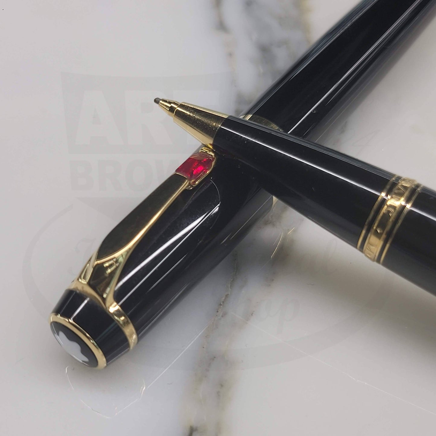 Montblanc Boheme preowned pen and pencil set in black resin with gold accents and a red gem detail on clip