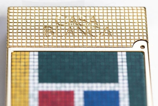 S.T. Dupont x Casablanca Ligne 2 C16122 brass lighter featuring gold-tone mosaic grid pattern with colorful geometric enamel inlays in green, yellow, red, and blue