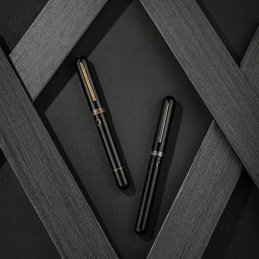 Nahvalur Nautilus Bronze Corydoras fountain pen in black ebonite with brass trim against dark textured diagonal background