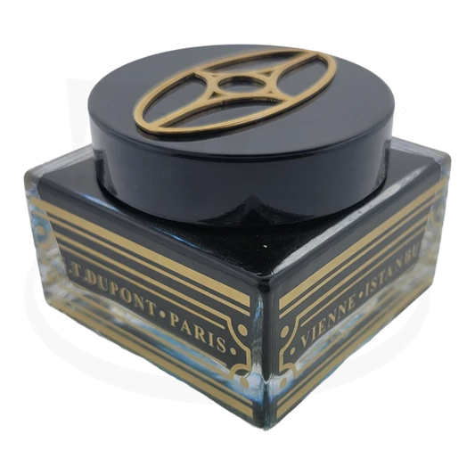 S.T. Dupont Orient Express glass ink bottle, black with gold accents, decorative top emblem, square base with Art Deco-style gold striping, 50mL capacity