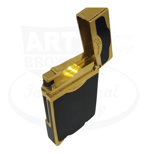 S.T. Dupont Oscuro 016513 luxury lighter in black lacquer and gold finish, displaying open lid with flame mechanism, refurbished by Art Brown
