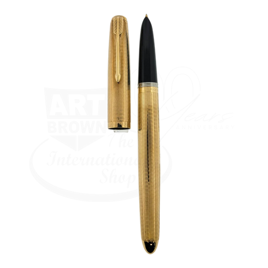 Vintage Parker 51 fountain pen in 9K solid gold with wavy line pattern and black grip section, gold clip detail