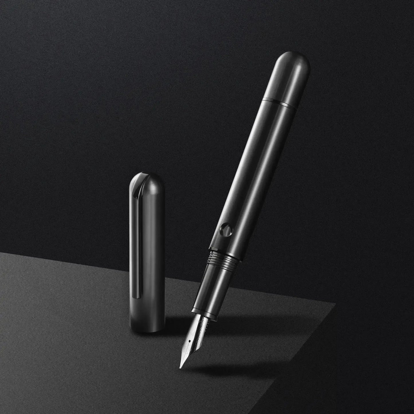 Nahvalur Nautilus Ti Black fountain pen in anodized titanium with piston-fill system and stainless steel nib shown uncapped