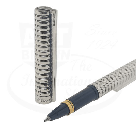 ST Dupont Classique Silver rollerball pen featuring ribbed metallic barrel with navy blue grip, brass accents, and signature palladium-plated cap design