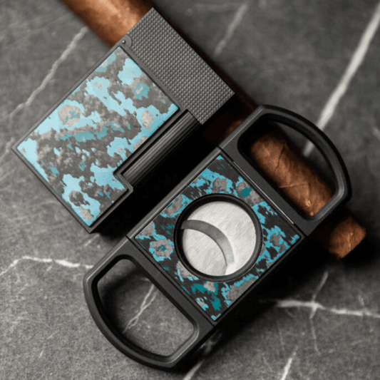 S.T. Dupont Carbon Fiber Ligne 2 Lighter and matching cutter, Glacial Cave motif in blue, gray and matte black.