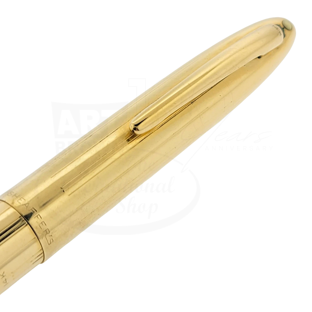 Sheaffer Snorkel fountain pen in solid 14K gold with subtle vertical line guilloche and polished clip detail