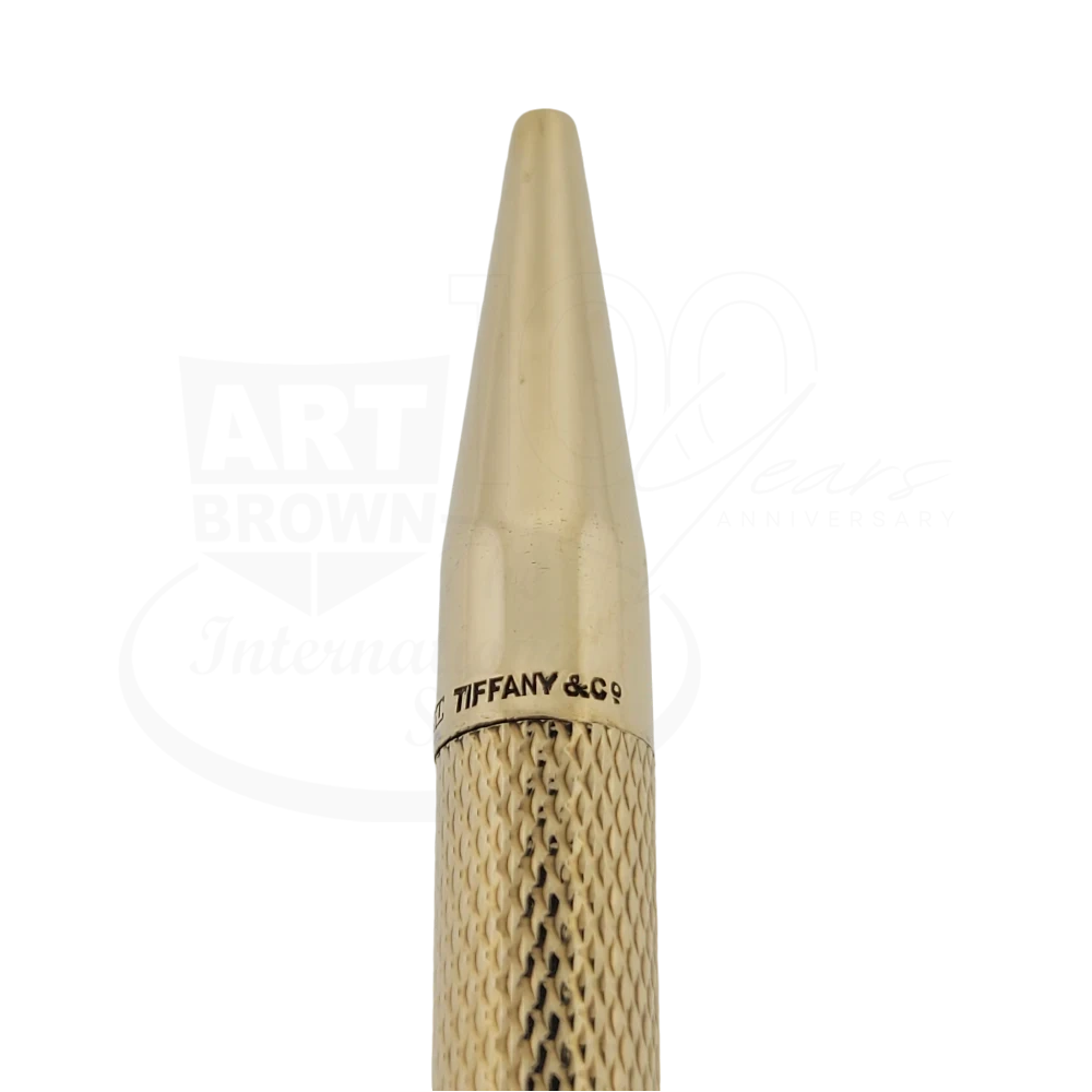 Preowned Tiffany & Co 14K Gold Barley Grain Ballpoint Pen close-up of gold textured barrel and pointed tip gallery six square