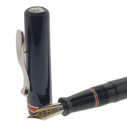 Preowned Visconti Voyager Midnight Coral Fountain Pen close-up of nib and cap with coral accent, gallery position 1 square image