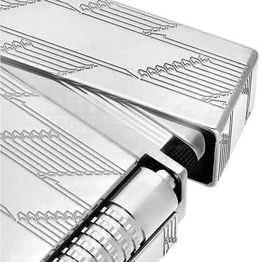 Close-up of a sleek palladium luxury lighter with detailed guilloche pattern and textured ignition wheel