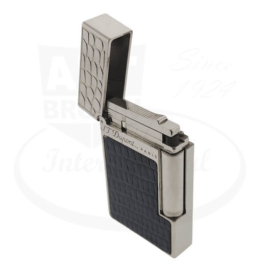 S.T. Dupont Ligne 2 black leather reptile-textured lighter with palladium finish, hinged lid open showing silver interior and flint mechanism