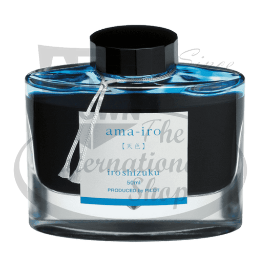 Pilot Iroshizuku glass ink bottle with black cap, featuring bright blue liquid and white label, contains 50ml fountain pen ink