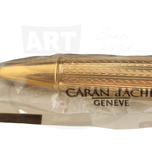 Caran d'Ache Collection Privee gold-plated ballpoint pen featuring engraved infinity pattern barrel, twist mechanism, limited edition 0380/2000, shown in original packaging