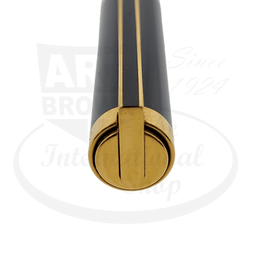 ST Dupont Classique brass ballpoint pen featuring black lacquer body with gold-plated clip and trim, showcasing distinctive round end cap design