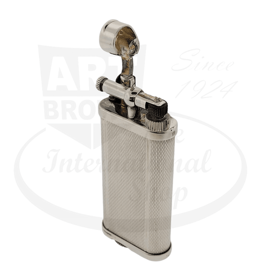 Dunhill Unique silver-plated lighter featuring hammer-style mechanism, textured barley grain pattern, display model with vintage patina