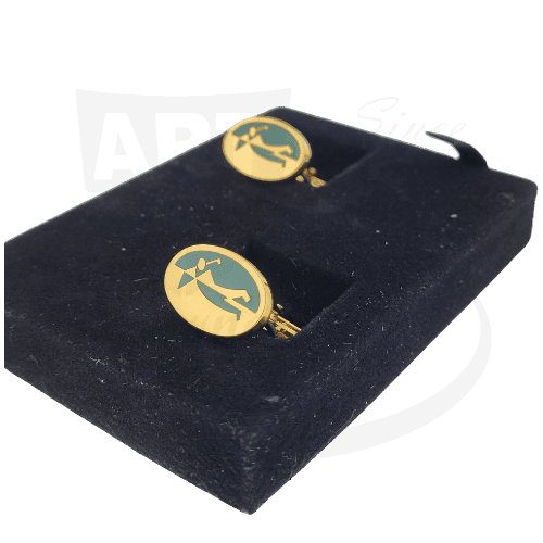Dunhill vintage gold vermeil cufflinks featuring black enamel golfer motif on oval faces, displayed on black velvet surface