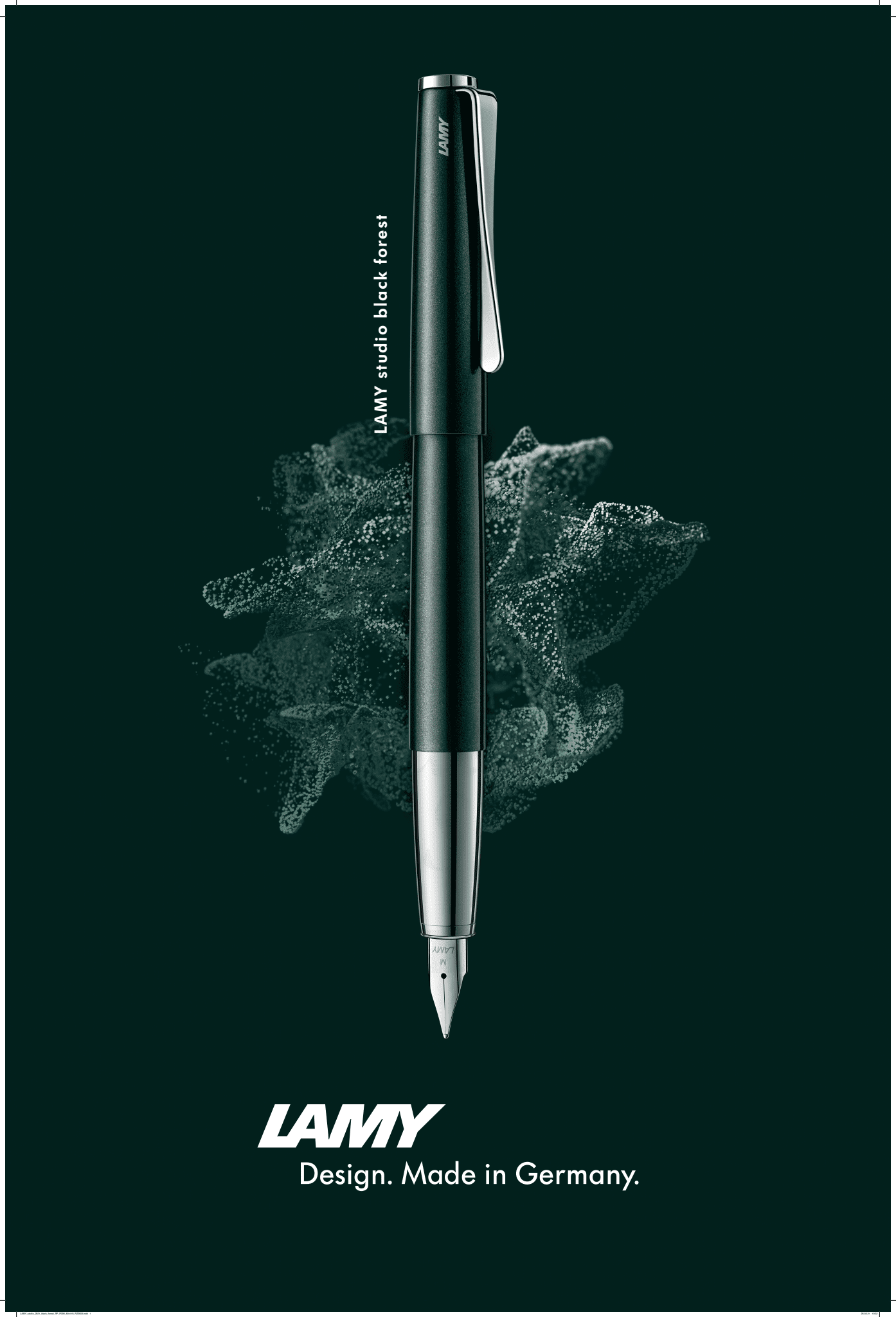 LAMY Studio Black Forest L69BFM fountain pen in glossy dark green lacquer with steel propeller clip and polished nib against forest green background