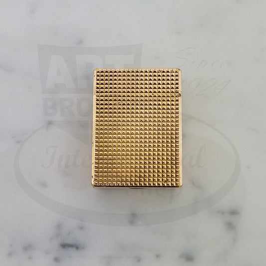 S.T. Dupont Ligne 1 vintage gold-plated lighter featuring diamond head guilloche pattern, rectangular shape with textured surface detail