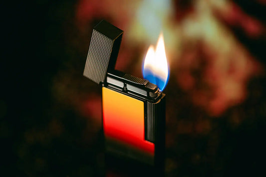 S.T. Dupont Ligne 2 lighter with matte black finish and yellow to red gradient lacquer.