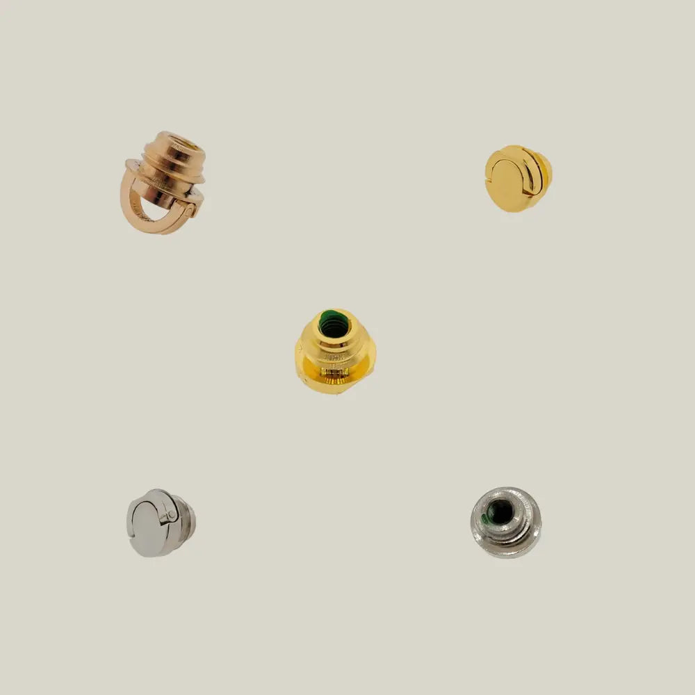 S.T. Dupont Gas refill covers in various finishes on beige background.