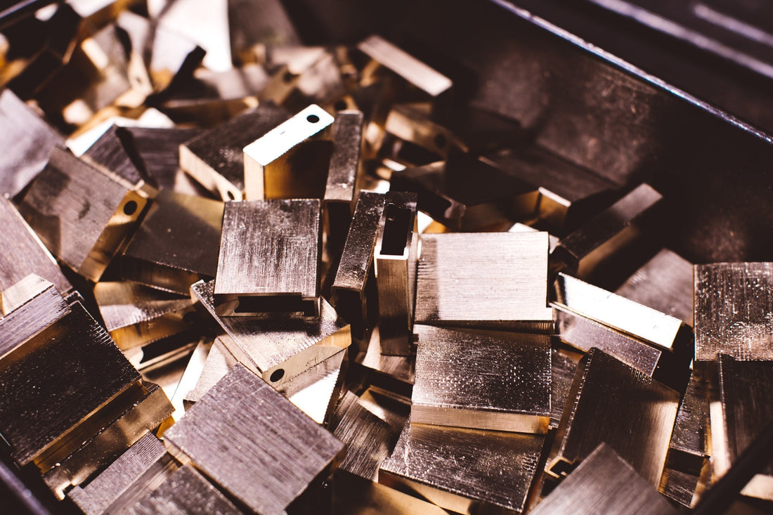 Brass S.T. Dupont lighter bodies before being engraved and lacquered.