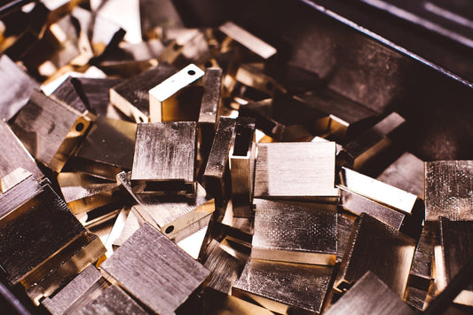 Brass S.T. Dupont lighter bodies before being engraved and lacquered.