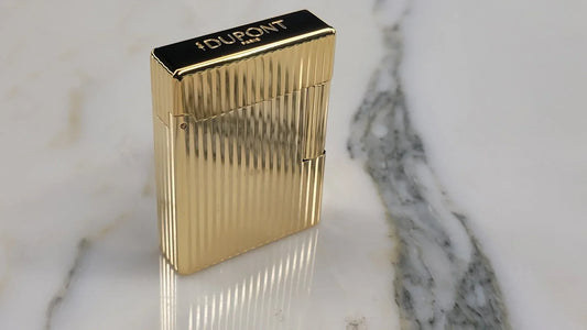 New S.T. Dupont Line 1 lighter, with gold vertical line guilloche, circa 2026