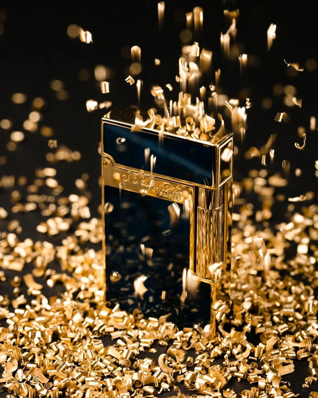 S.T. Dupont lighter surrounded by gold shavings
