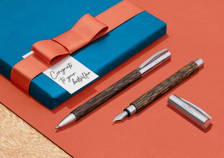 Faber-Castell Ambition fountain pen wit coconut wood and chrome accents.