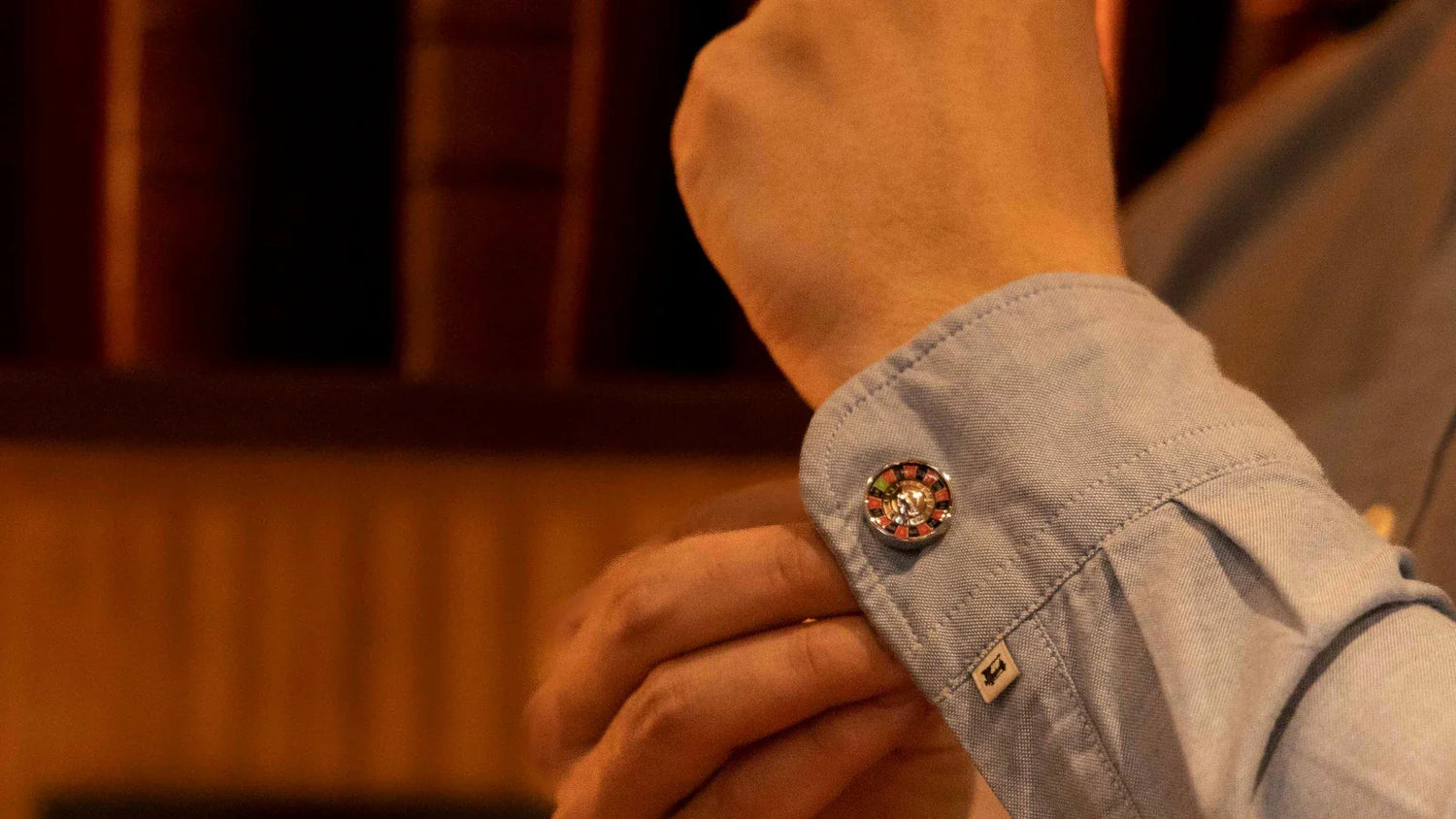S.T. Dupont Roulette cufflink being put on dress shirt sleeve