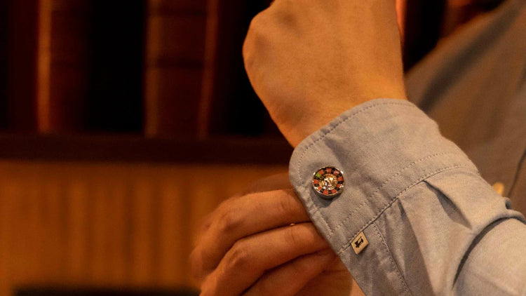 S.T. Dupont Roulette cufflink being put on dress shirt sleeve