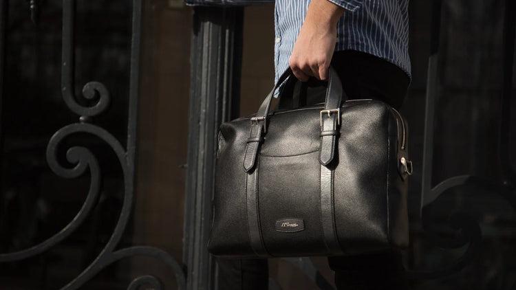 Man carrying black soft leather document holder from S.T. Dupont 