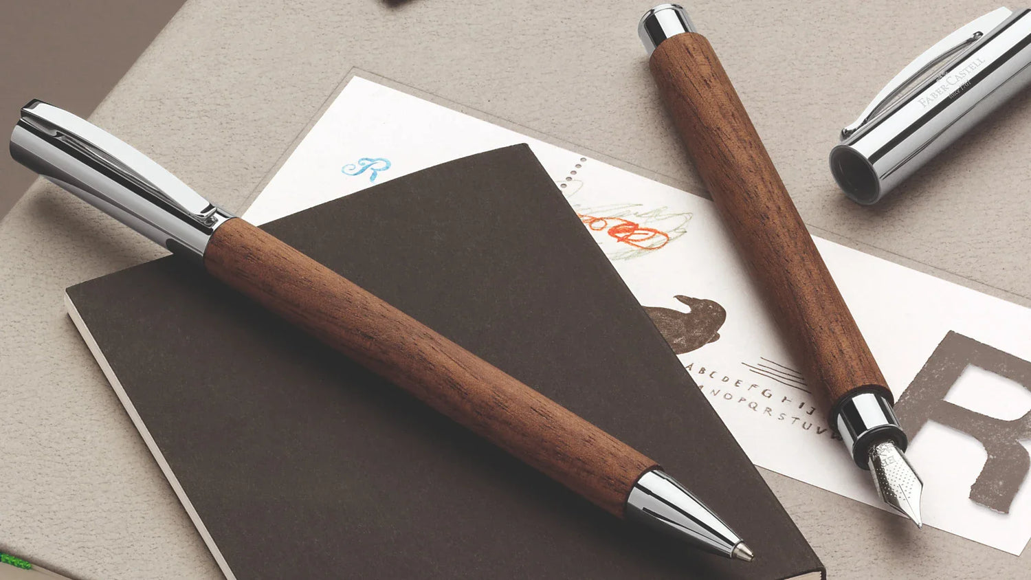 Faber-Castell ambition fountain and ballpoint pens with walnut wood barrels and chrome accents