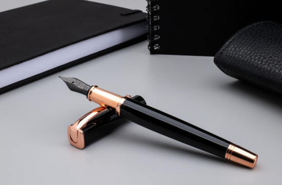 Monteverde Impressa fountain pen with black stainless steel nib, black resin barrel, and rose gold accents
