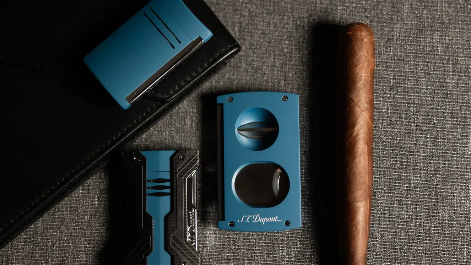 S.T. Dupont defi Extreme, maxijet, and double blade cutter in petrol blue.