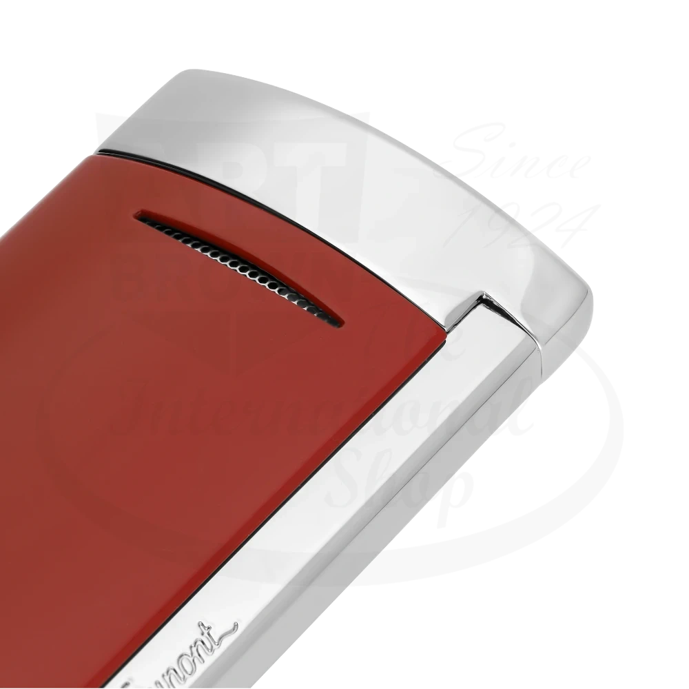 Corner of S.T. Dupont Minijet torch lighter with brilliant red lacquer and chrome finish