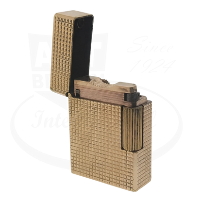 S.T. Dupont Ligne 1 BS 012110 gold metal lighter with textured diamond head pattern and flip-top design
