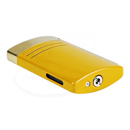 S.T. Dupont Maxijet torch lighter in honey yellow with gold accents, showing refill and flame adjustment valves on the bottom.