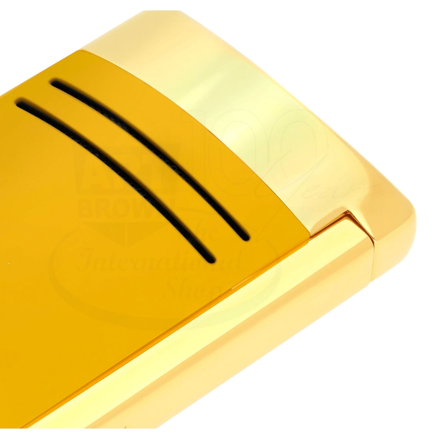 Close up of detailed finish on S.T. Dupont Maxijet torch lighter in honey yellow with gold accents.