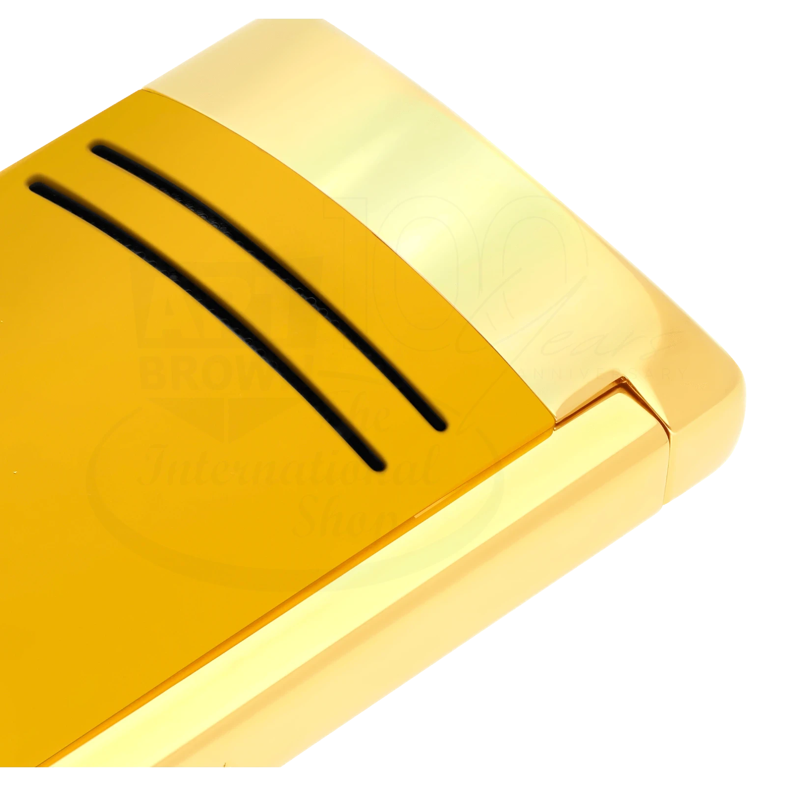 Close up of detailed finish on S.T. Dupont Maxijet torch lighter in honey yellow with gold accents.