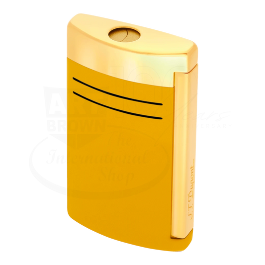 S.T. Dupont Maxijet torch lighter in honey yellow with gold accents, seen from a side angle.
