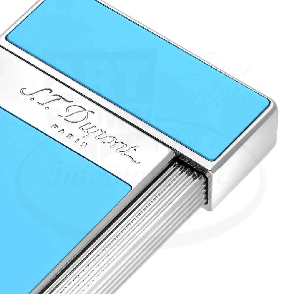 Corner of S.T. Dupont slimmy torch lighter with light blue lacquer and chrome accents 