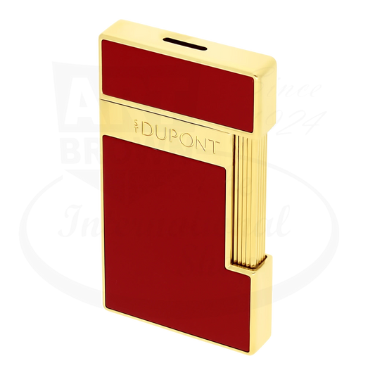 S.T. Dupont slimmy lighter with red lacquer and gold finish, seen from an angle.