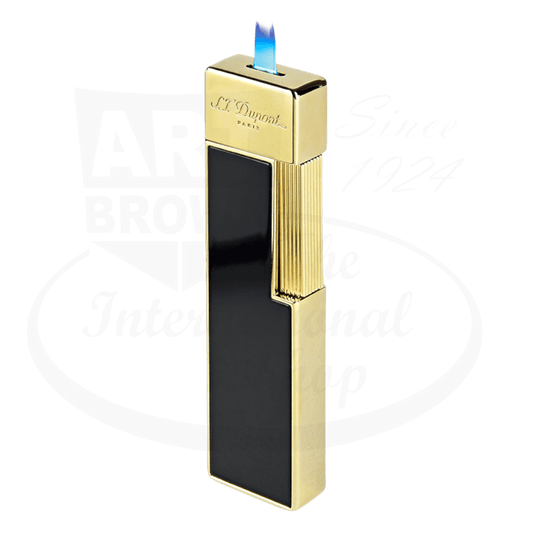 S.T. Dupont Twiggy 030002 lacquer lighter in black and gold metal with vertical ridged design, slim profile and bright blue torch flame