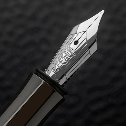 Graf von Faber-Castell Classic Macassar fountain pen nib with detailed engraving and polished silver finish close-up