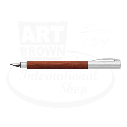 Faber-Castell Ambition Pearwood Fountain Pen with polished chrome cap and warm reddish wood barrel sleek design