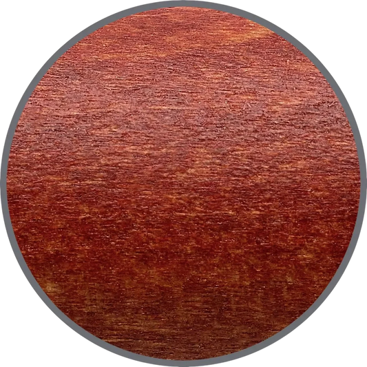Faber-Castell Ambition Pearwood fountain pen barrel close-up showing reddish natural wood grain texture