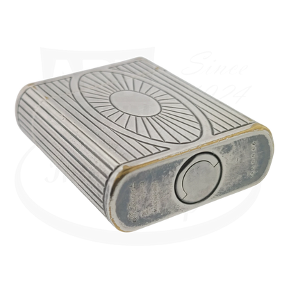 Preowned Vintage S.T. Dupont Soubreny 019105-D1 Palladium lighter with Sun Medallion, guilloche design, visible wear and discoloration.