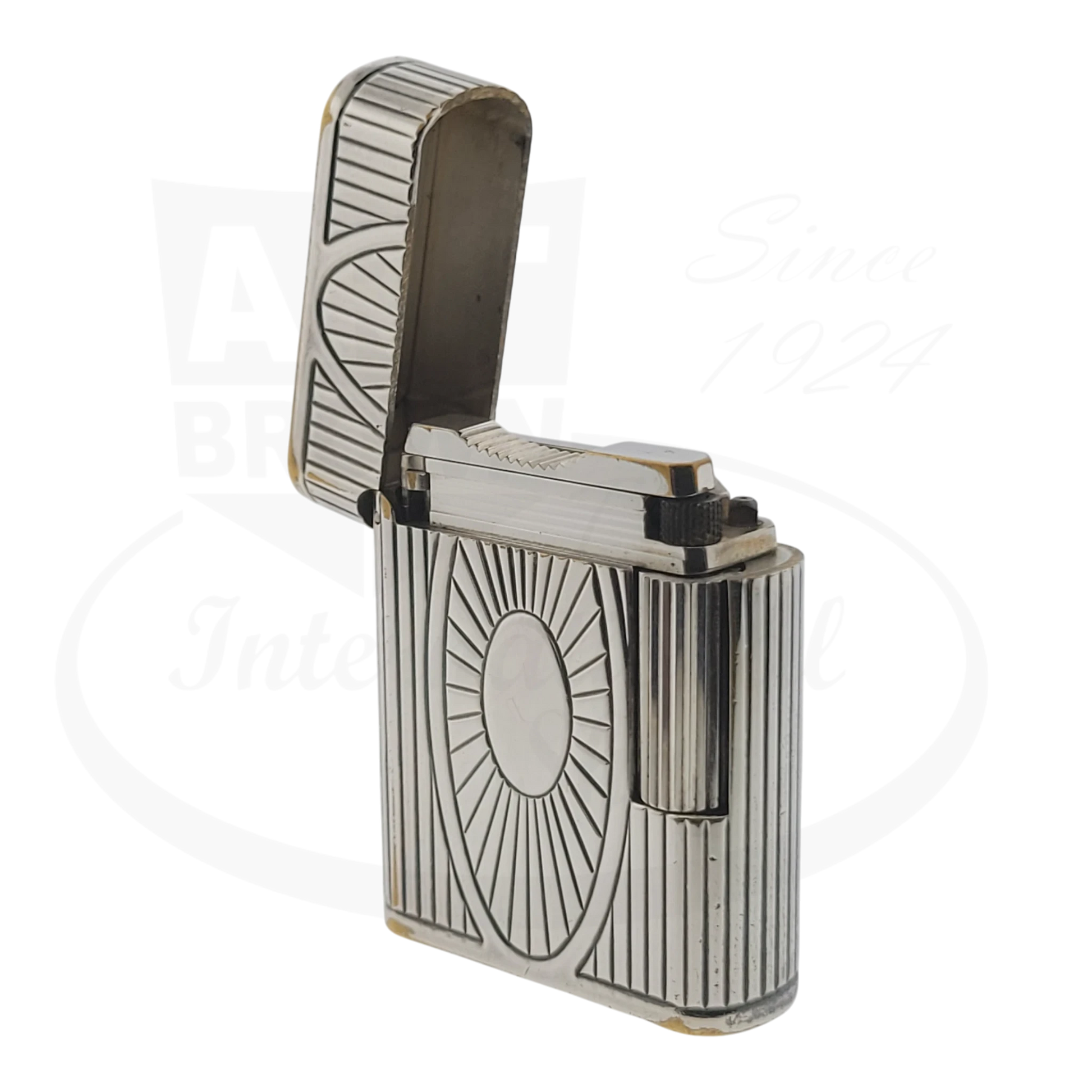 Preowned Vintage S.T. Dupont Soubreny 019105-D1 palladium lighter with Sun Medallion guilloche design and visible wear.
